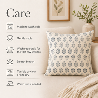 A decorative throw pillow with a cream and gray damask pattern is styled on a beige sofa next to a blanket, with a care instructions graphic overlay on the left.
