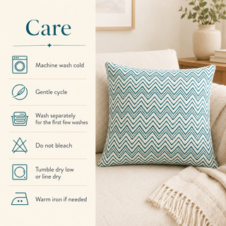 A decorative throw pillow with a teal and white chevron pattern sits on a beige sofa in a living room setting, next to a vertical 'Care' instruction panel detailing washing and drying instructions.