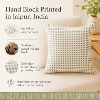 A hand-block printed throw pillow with a beige and gray geometric grid pattern, styled on a cream sofa next to a wooden side table with a potted plant. The left side of the image features text and icons explaining the handcrafted, artisanal, and locally printed nature of the product.