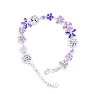 Bracelet with purple and pink floral charms on a white background