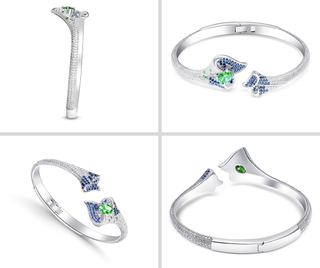 Silver bracelet with green and blue gemstones on a white background