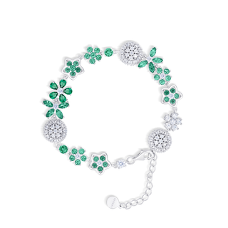 Silver bracelet with green gemstones on a white background