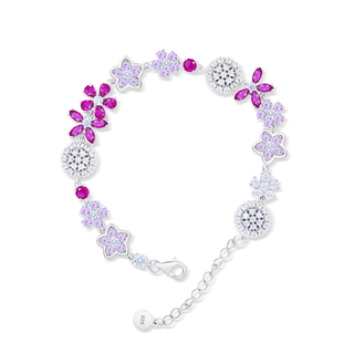 Bracelet with floral and round charms on a white background