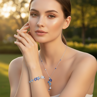 Woman wearing a necklace and bracelet with a blurred natural background