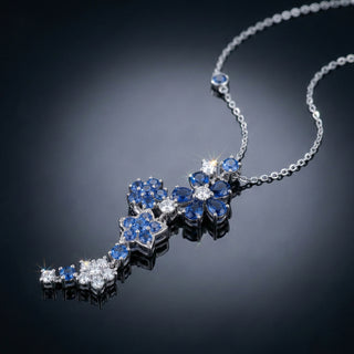 Elegant necklace with blue and white gemstones on a dark background
