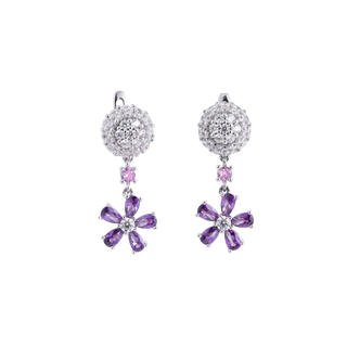 Pair of earrings with purple gemstones on a white background