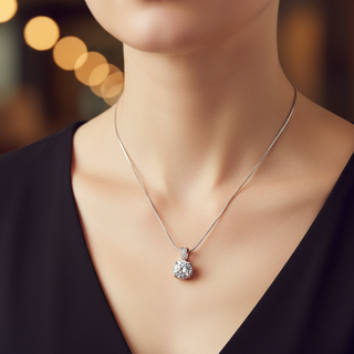 Silver necklace with a pendant on a blurred background